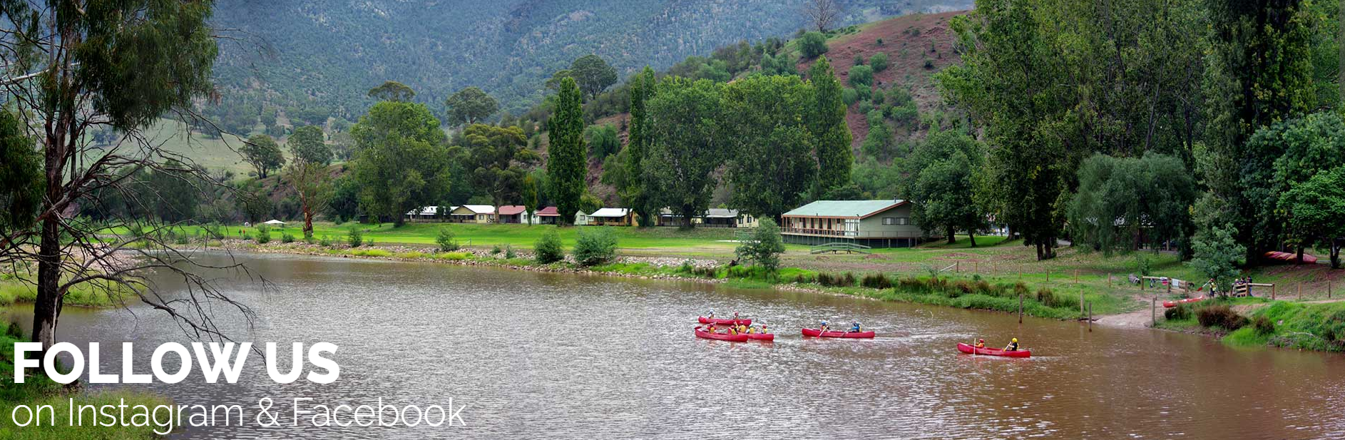 A river with red kayaks below forested hills, captioned Follow us on Instagram and Facebook.