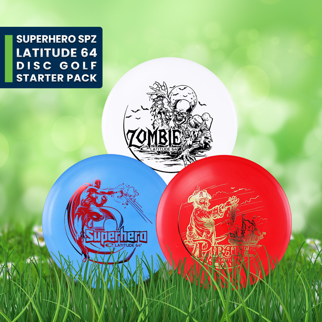 Latitude 64 Superhero SPZ starter pack: white, blue and red discs with illustrated stamps, resting on grass.