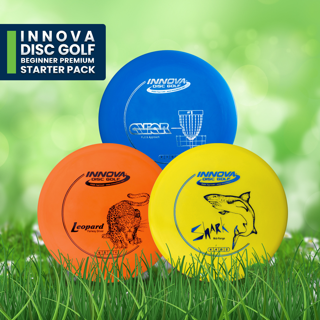 Innova beginner premium starter pack: a blue driver, orange midrange and yellow putter resting on grass.