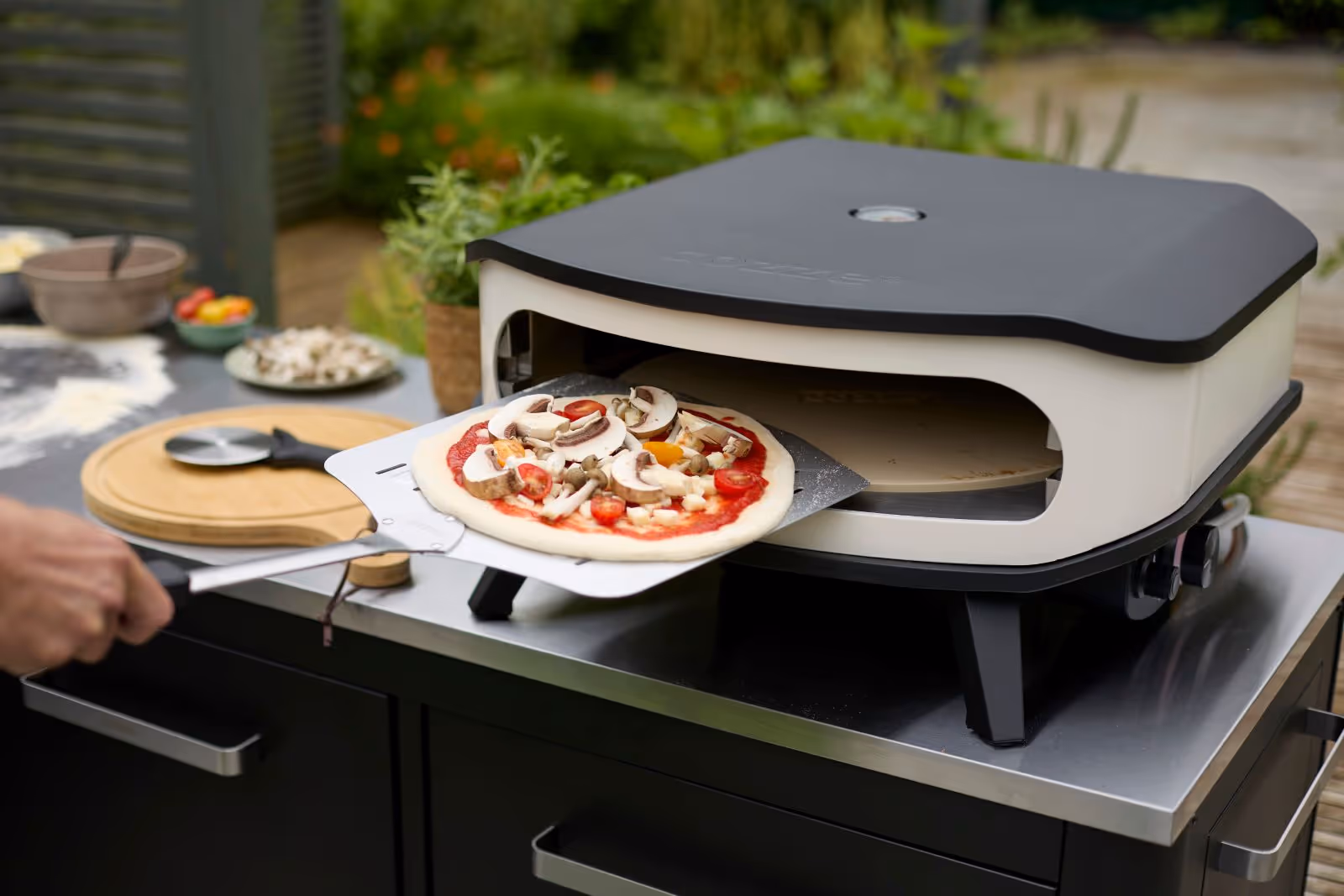 A pizza sitting on top of a pizza oven.