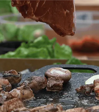 Chef preparing food outdoors