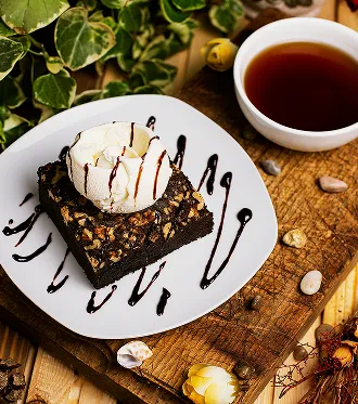 Chocolate dessert with berries and coffee