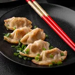 Dumplings served with vegetables