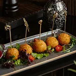 Crispy fried appetizers with dipping sauce