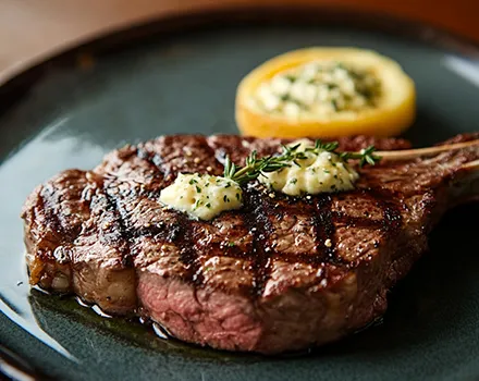 Grilled steak with butter and vegetables