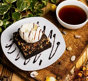 Chocolate dessert with berries and coffee