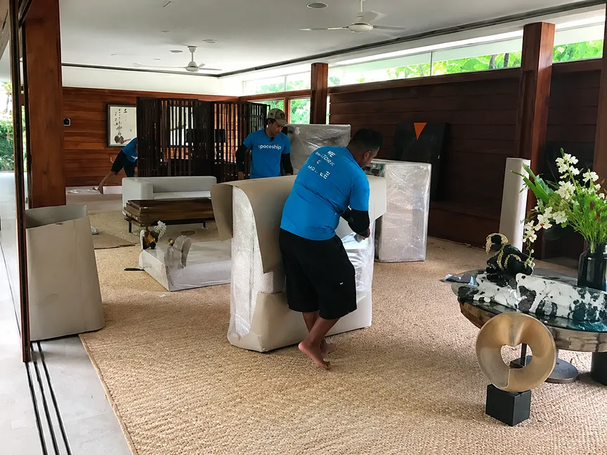 Spaceship movers protecting and preparing belongings during the door-to-door storage process