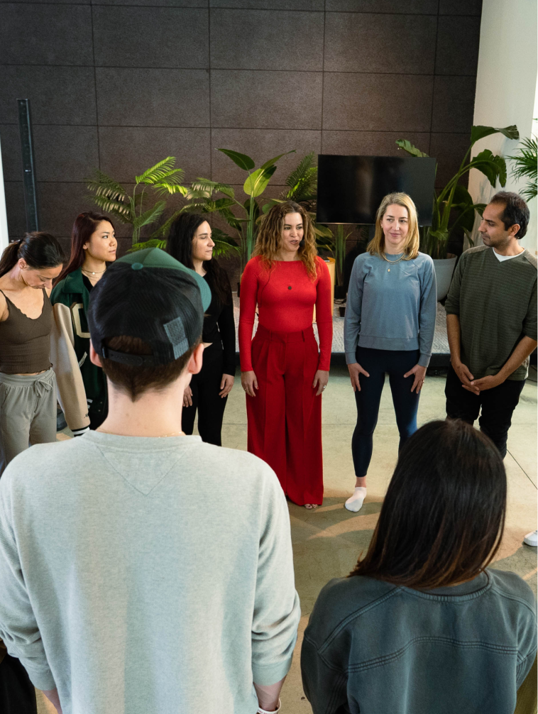 Group participating in a guided wellness exercise