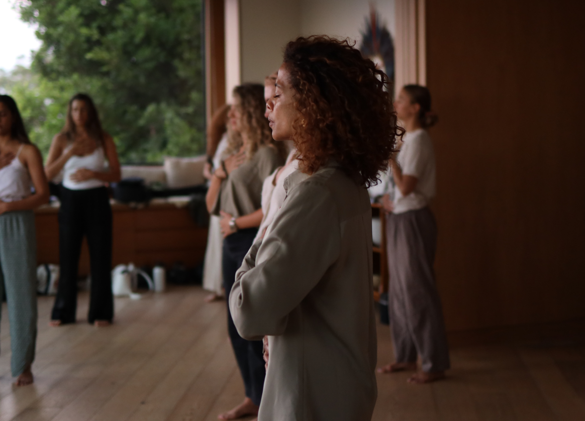 Women practicing somatic exercises in a group