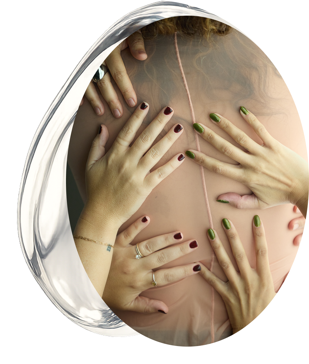 Group of women placing hands on a person’s back