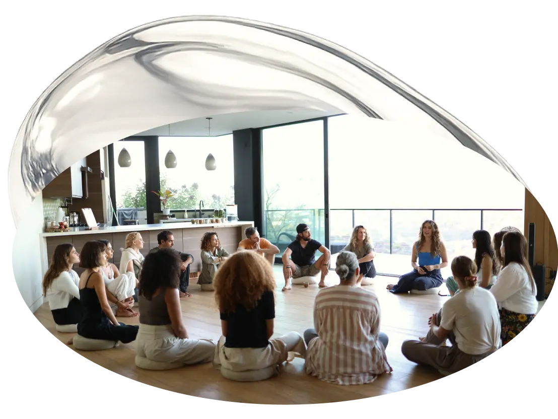 Group of people sitting in a circle during a wellness session
