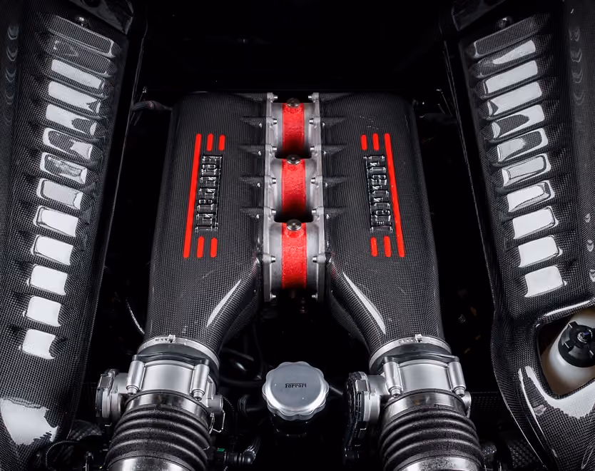 Ferrari V8 engine bay in carbon fibre and red
