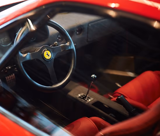 Ferrari F40 interior seen through the driver's window