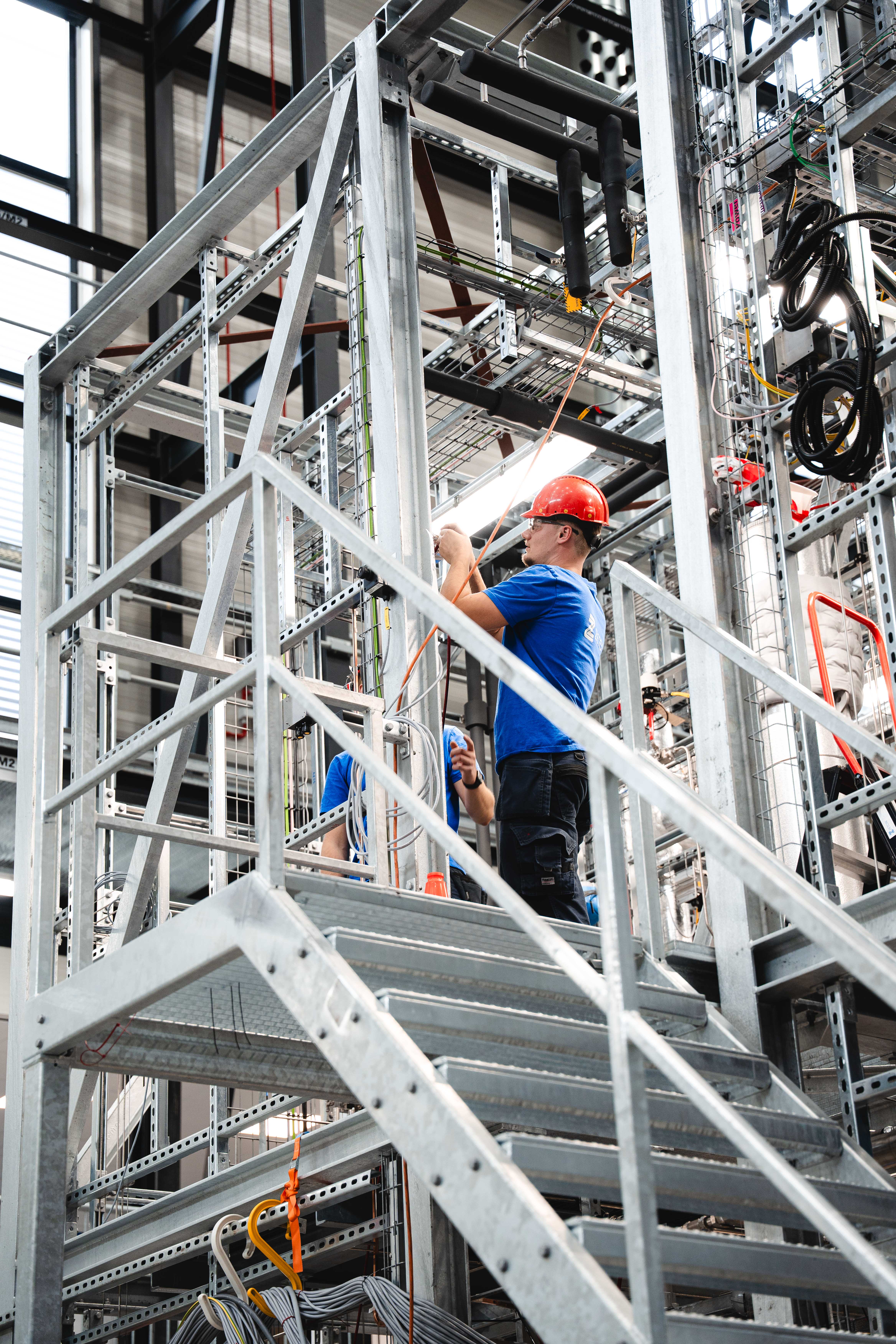 Zeton engineer on the platform of a multi-level pilot plant