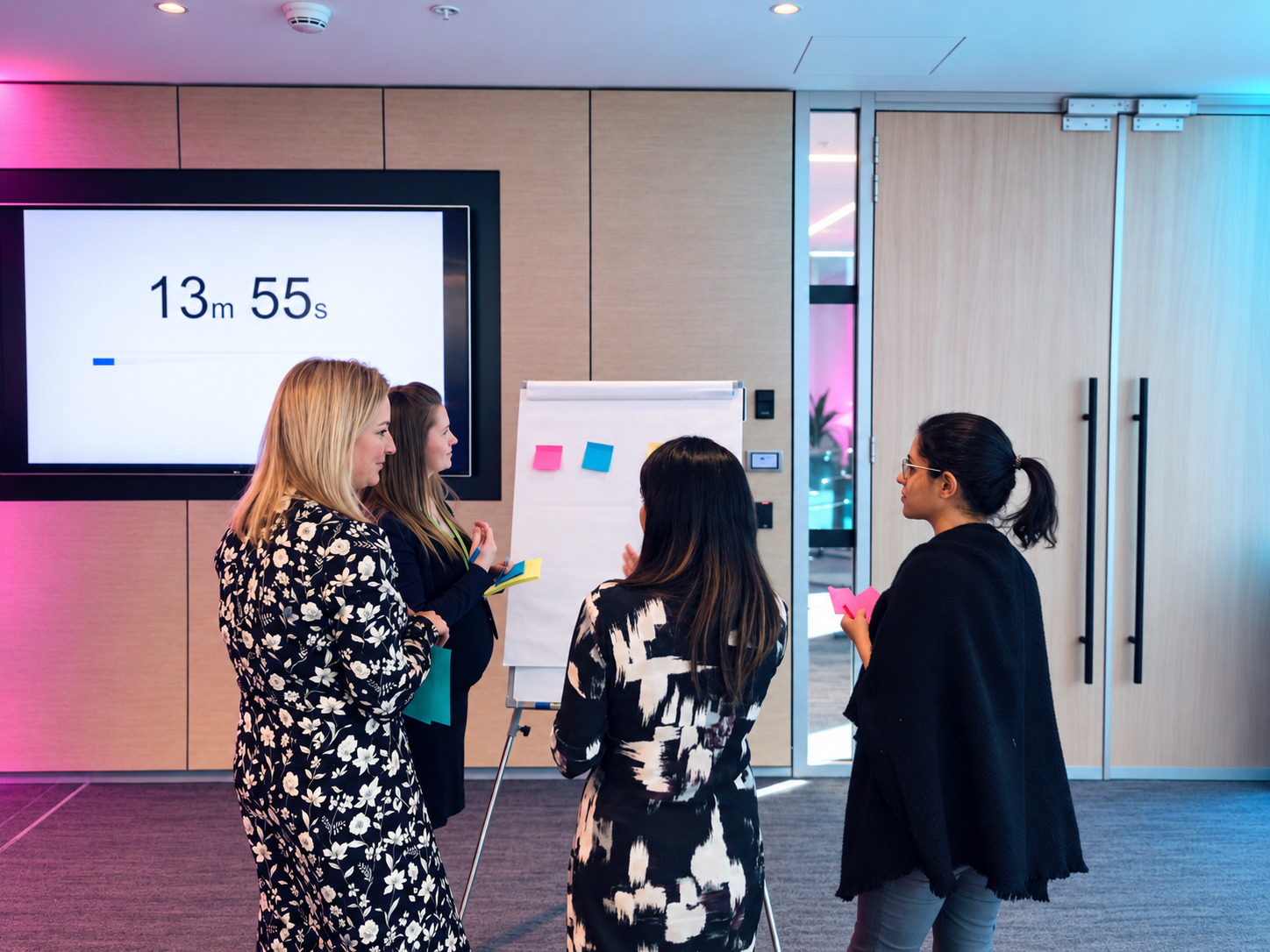 Team working through ideas on a whiteboard