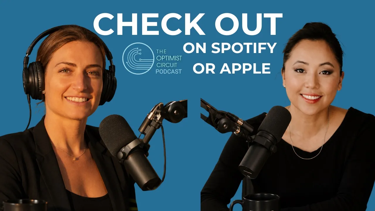 Two women smiling, each speaking into a microphone with one wearing headphones, against a blue background with text promoting The Optimist Circuit Podcast on Spotify or Apple.