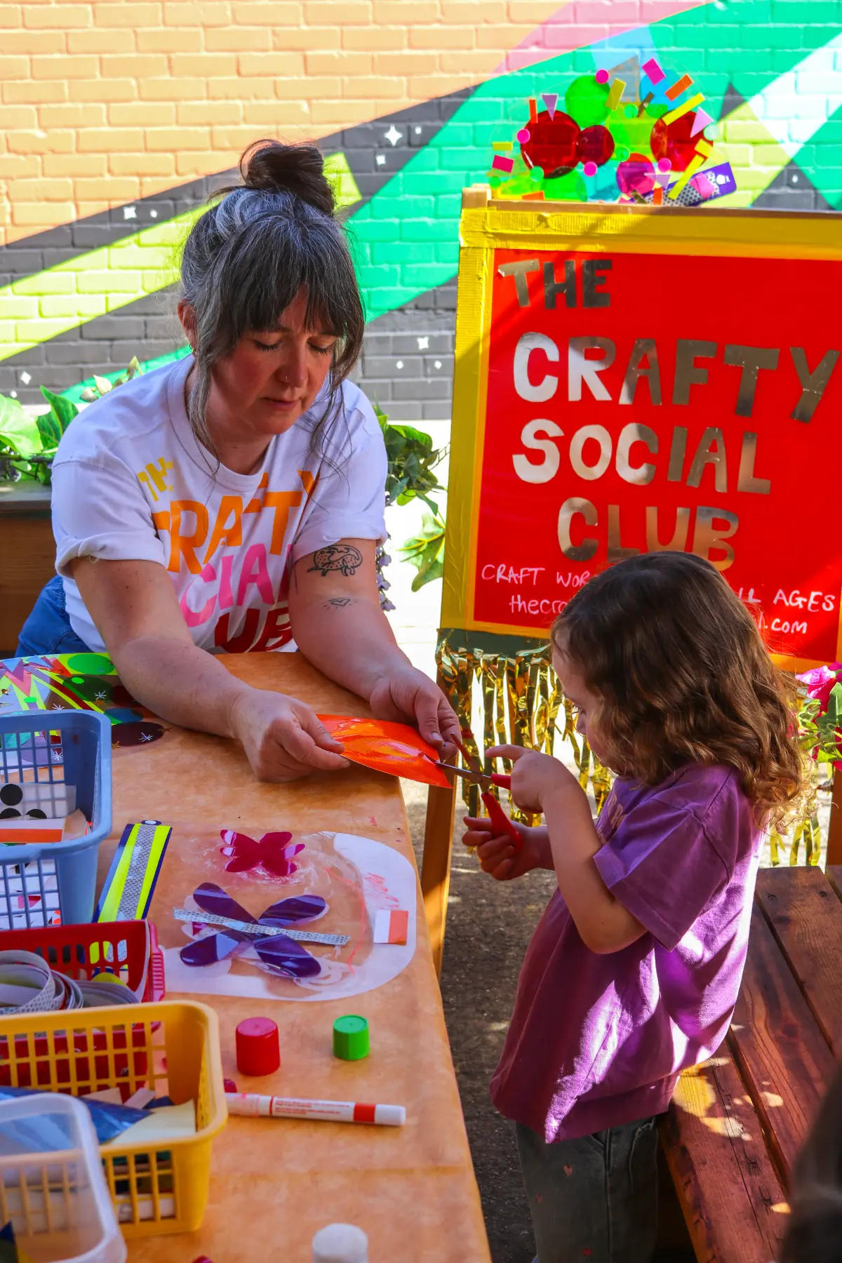 Children painting during a free drop-in Craft Session in Junkyard at Wake The Tiger