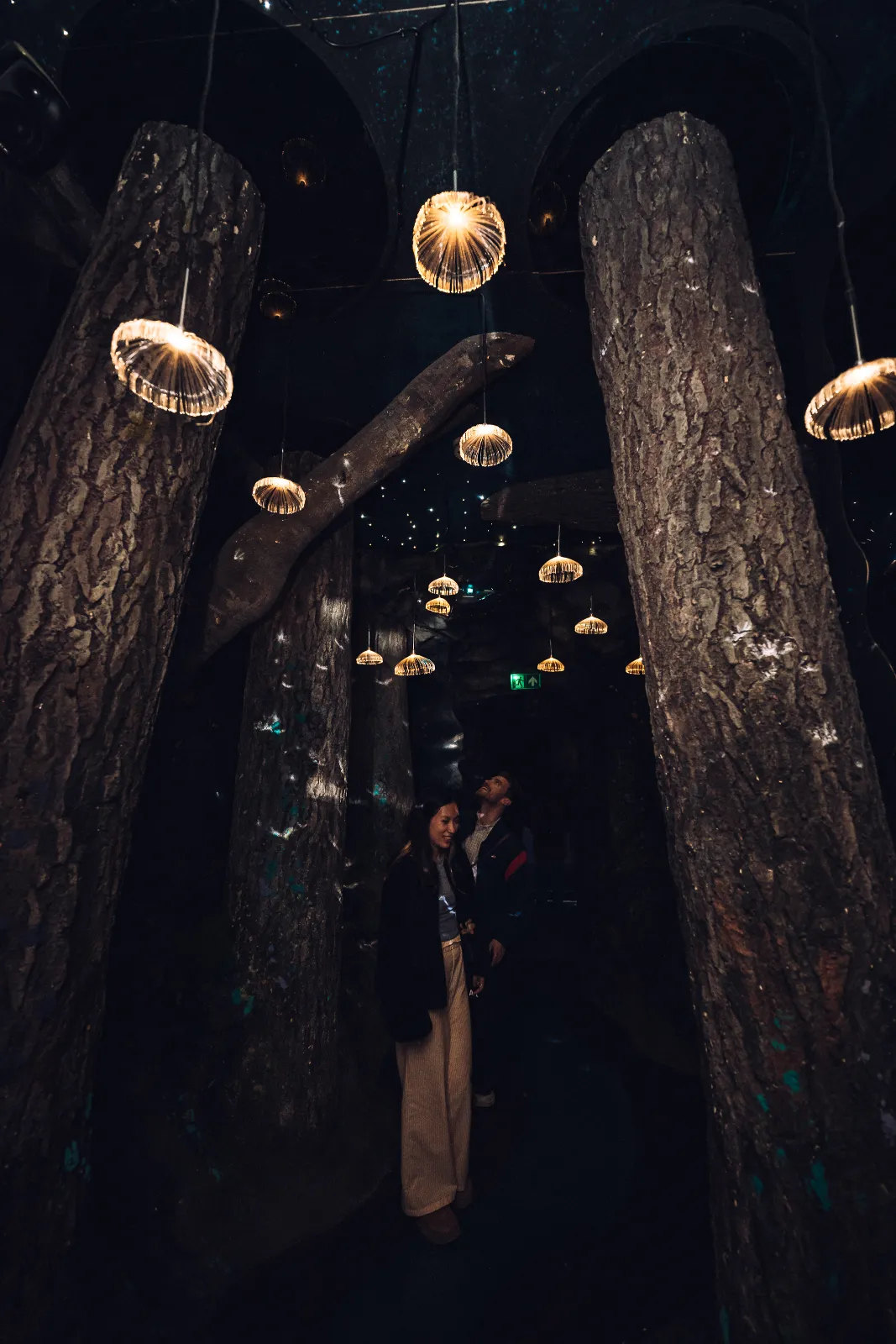 Visitors exploring an immersive art scene during After Hours at Wake The Tiger
