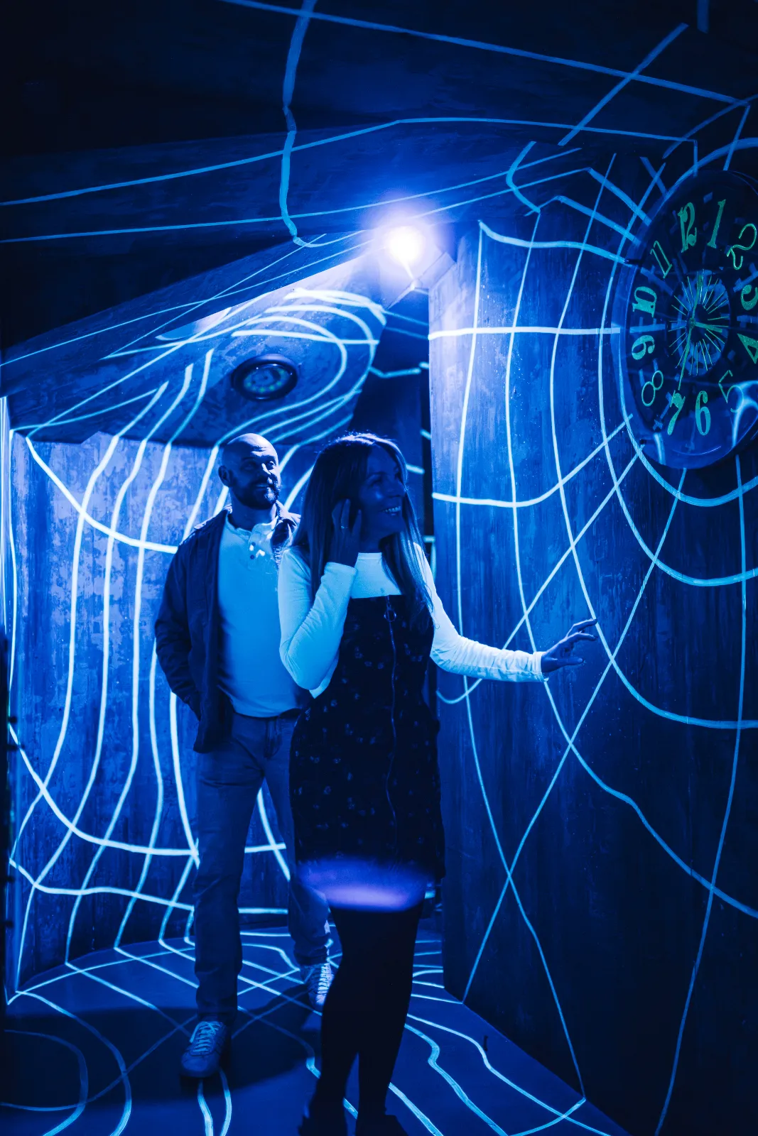 Adults enjoying a themed room during After Hours at Wake The Tiger