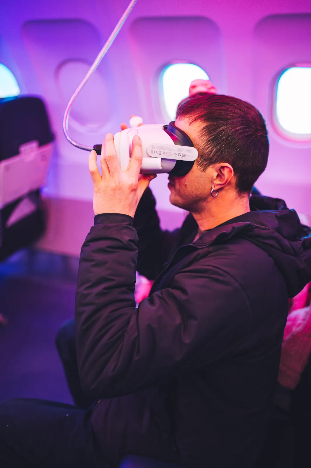 Man looking through a virtual reality headset at Wake The Tiger.