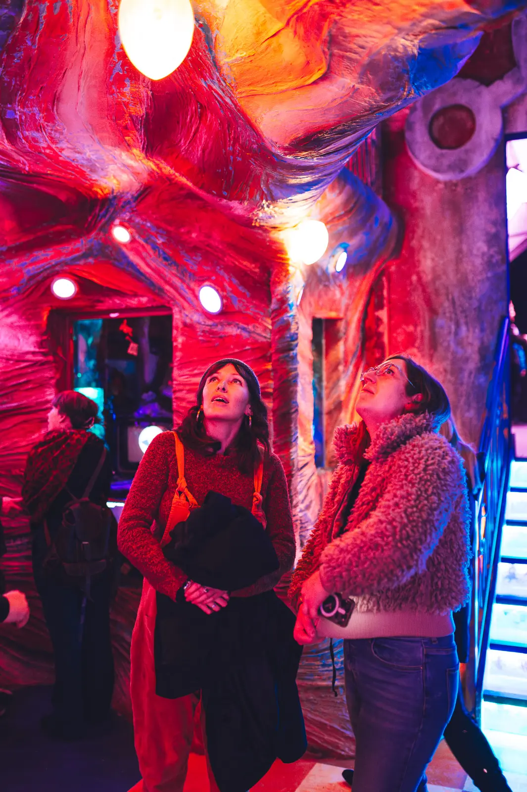 Women exploring the Aetheria installation and looking amazed at Wake The Tiger