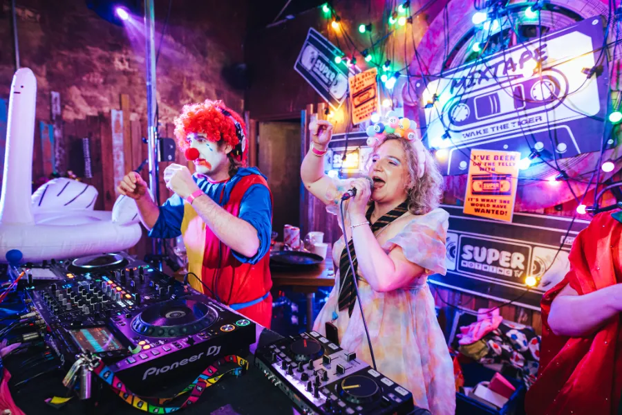 MIXTAPE event at Wake The Tiger performers and DJs in fancy dress.