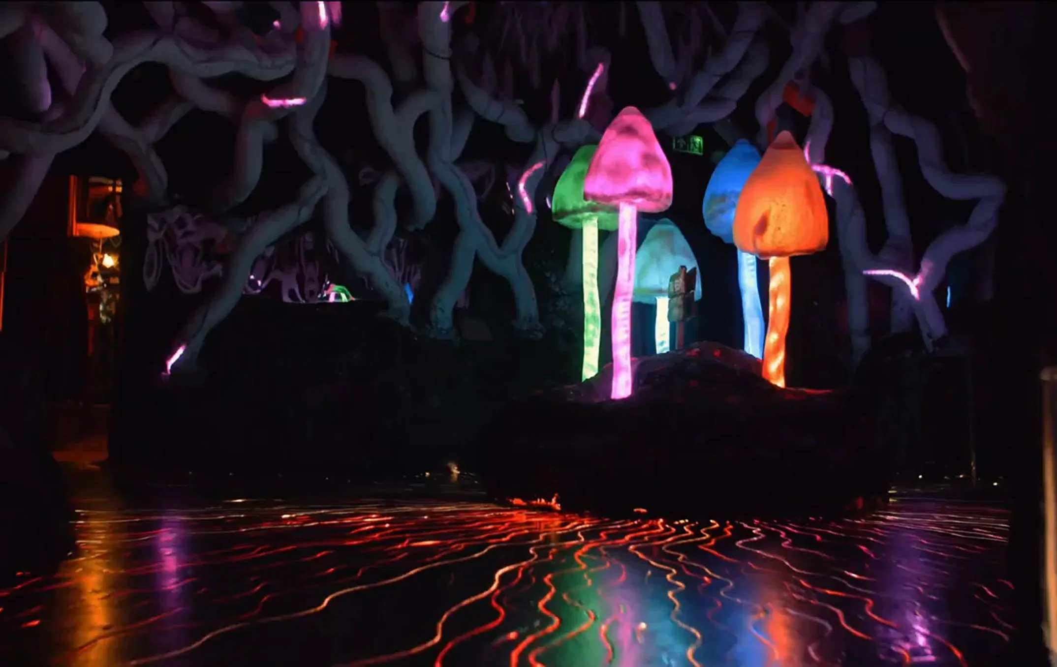 Glowing mushrooms inside the cave installation at Wake The Tiger