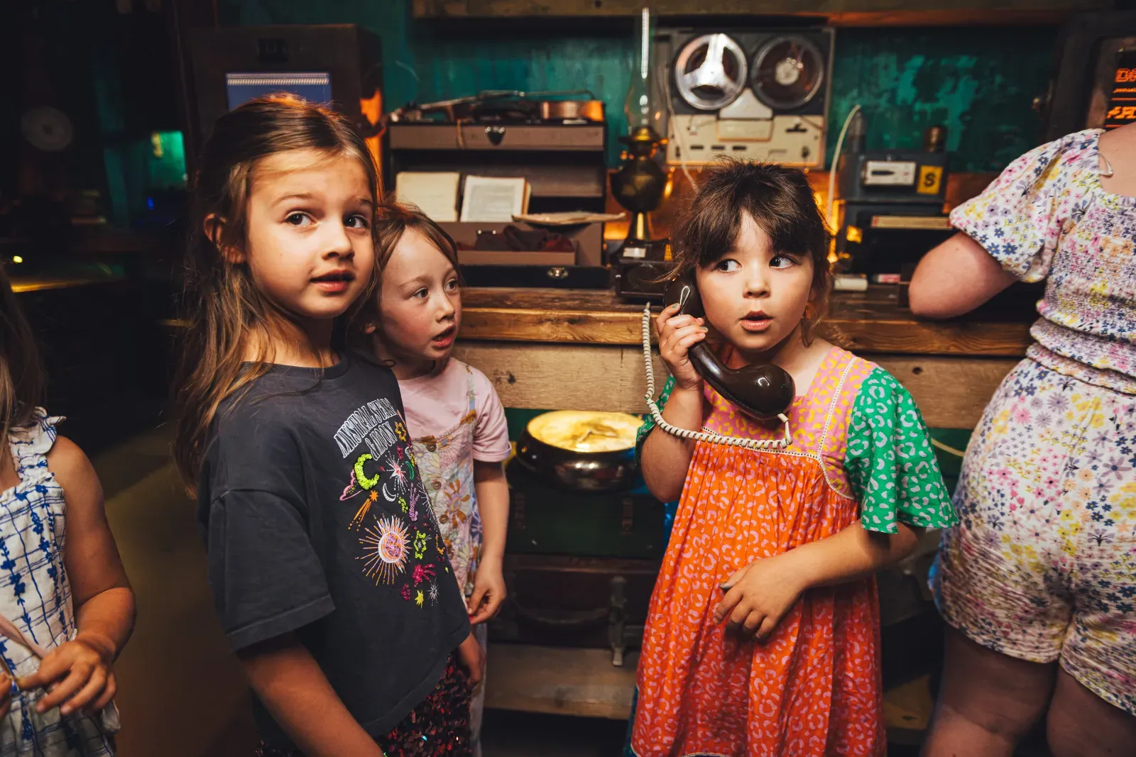 Children playing with a vintage phone at Wake The Tiger
