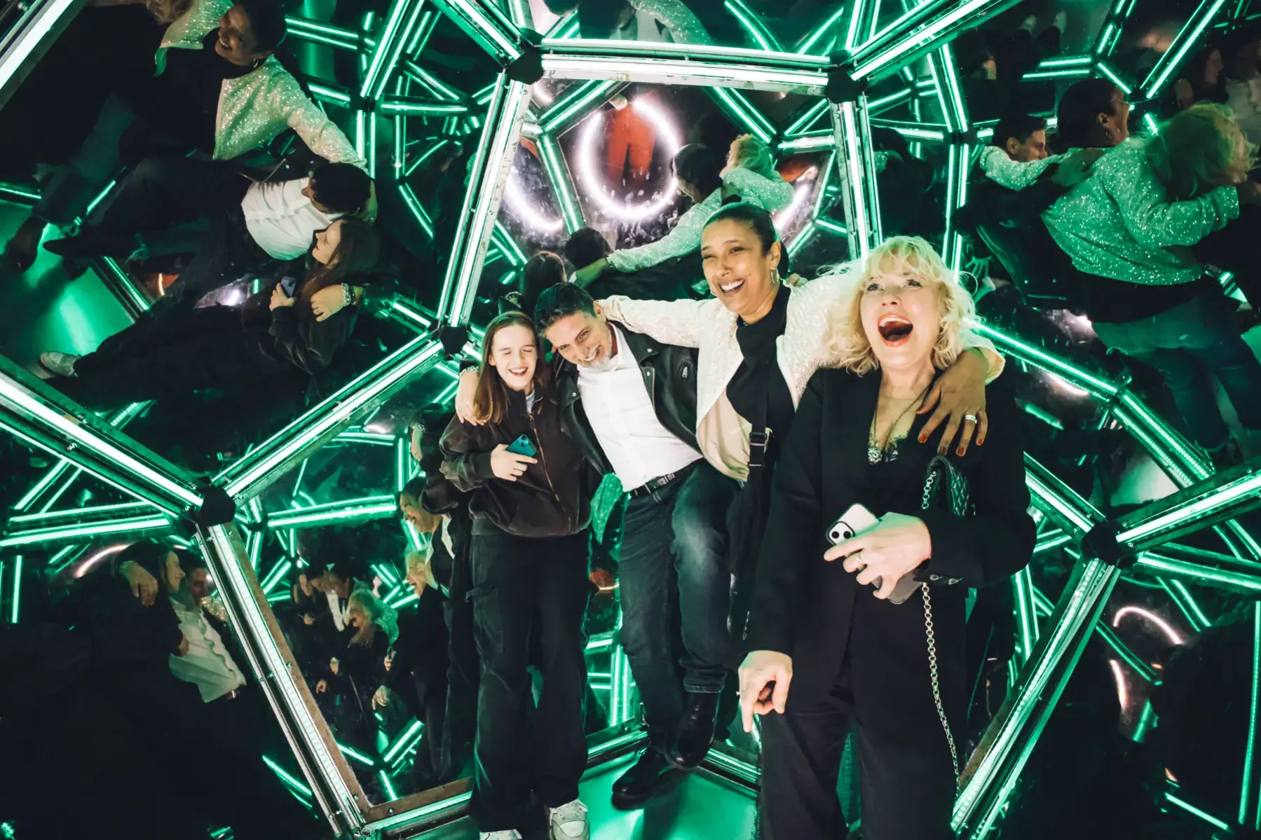 Green-lit interactive structure at a Wake The Tiger party