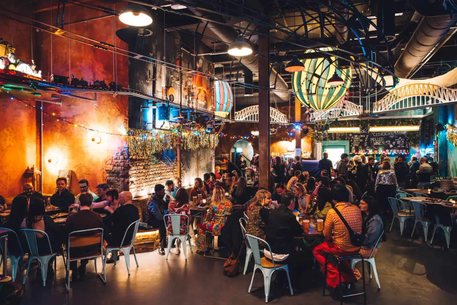 Busy Junktion bar with lights and guests at Wake The Tiger