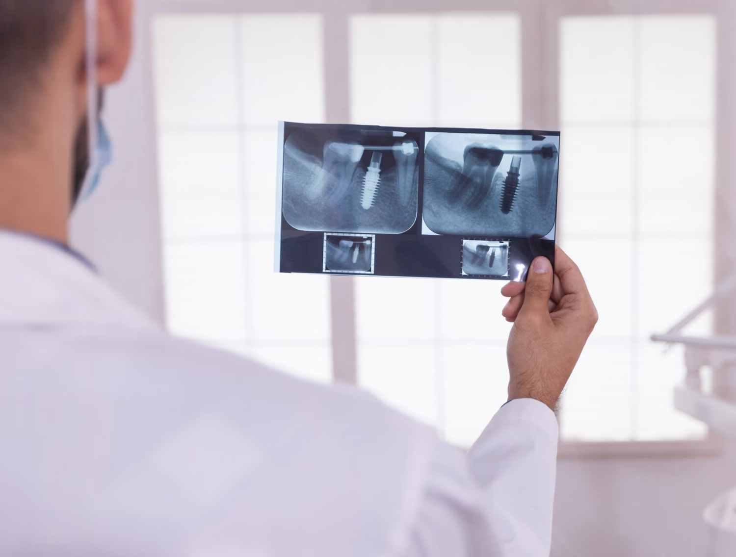 Dentist reviewing dental x-rays