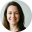 Headshot of a smiling woman with long dark hair