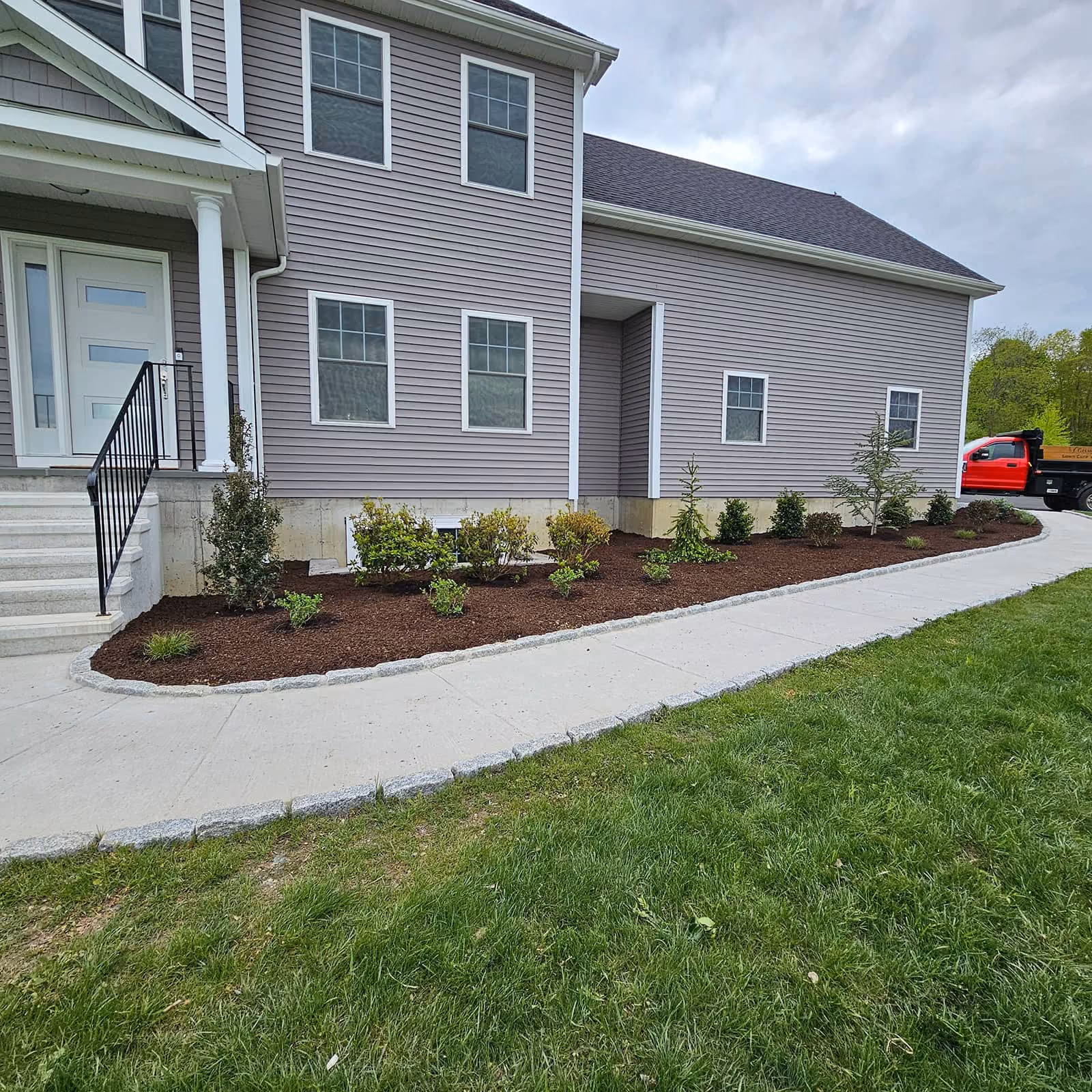 Property-maintenance team edging walkway, Classic Outdoors Kent CT