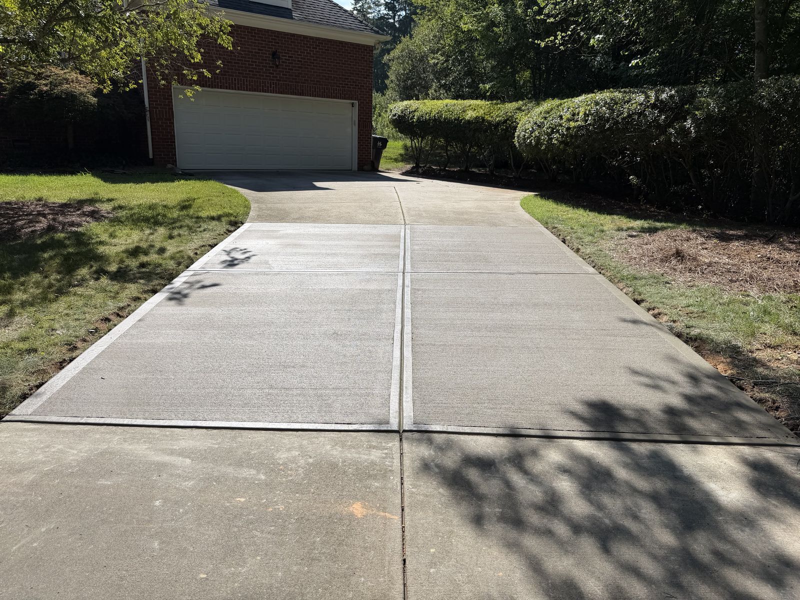 Newly poured concrete driveway installation in Charlotte, NC