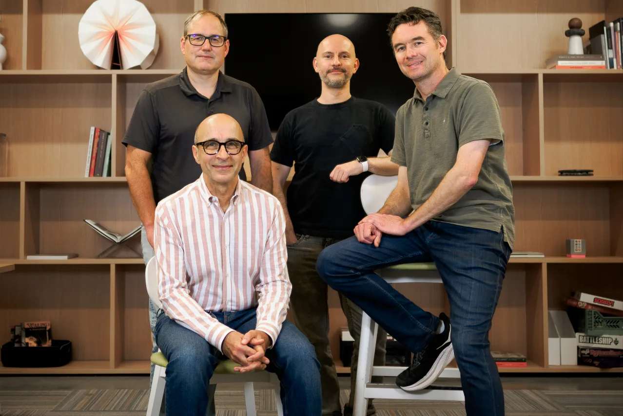 Northstar team members together in the office, one seated in front
