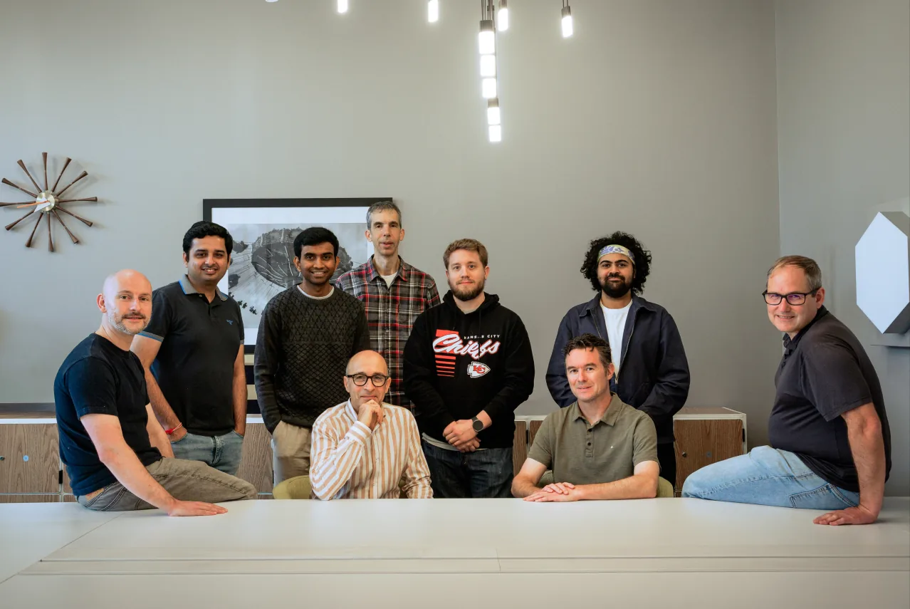 The Northstar team gathered around a table in the office