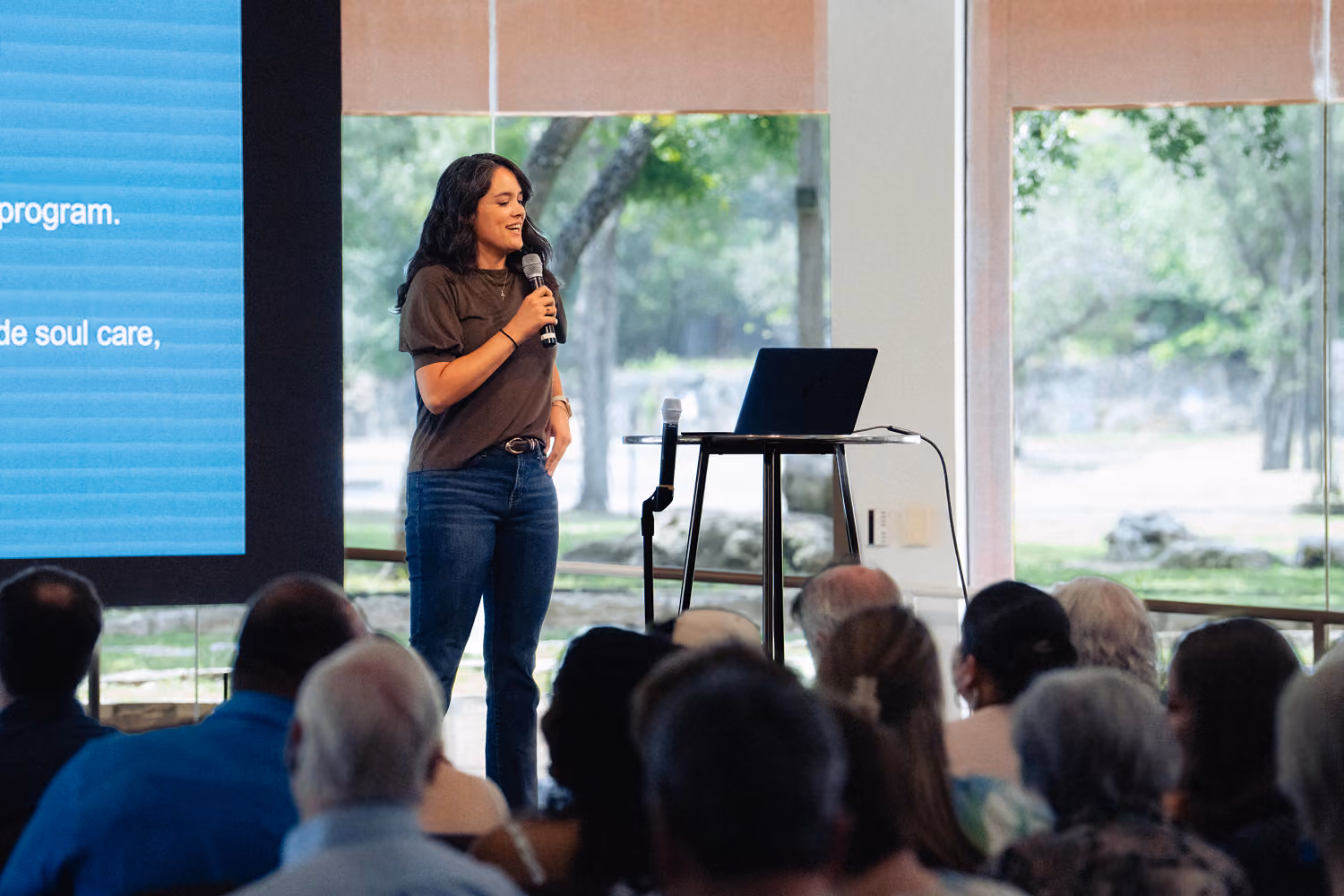 woman speaking on stage