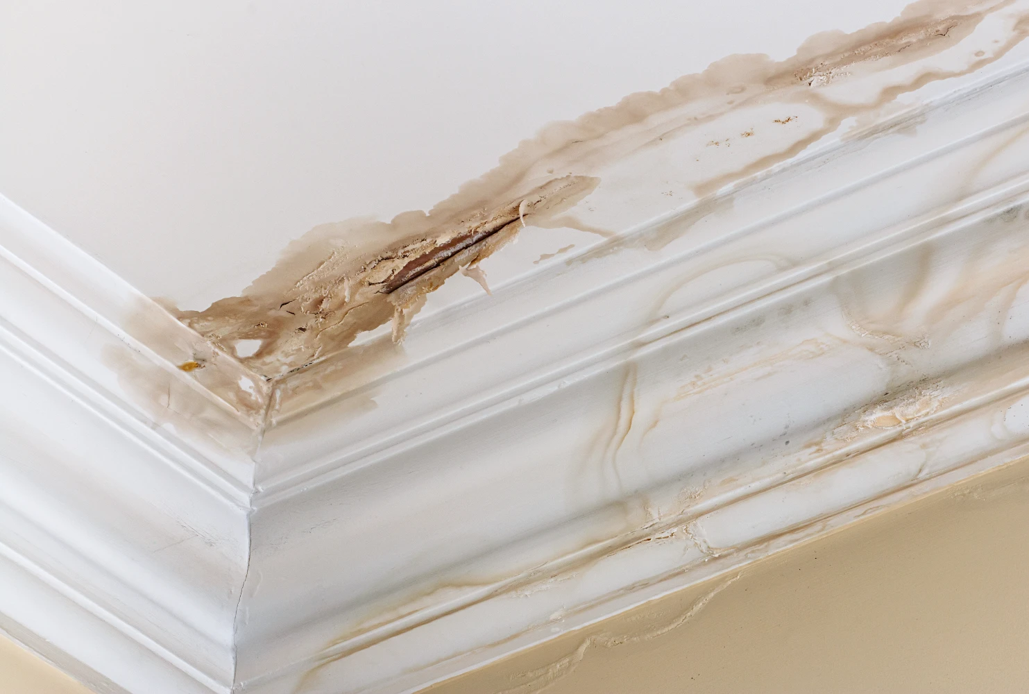 Staining on ceiling caused by water damage.