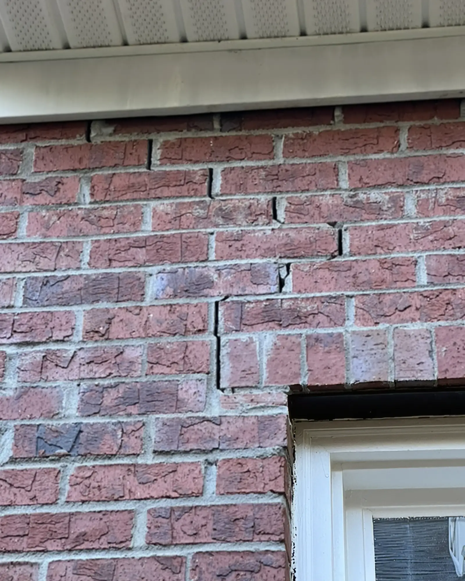 External brick cracking due to moisture weakening the home's foundation