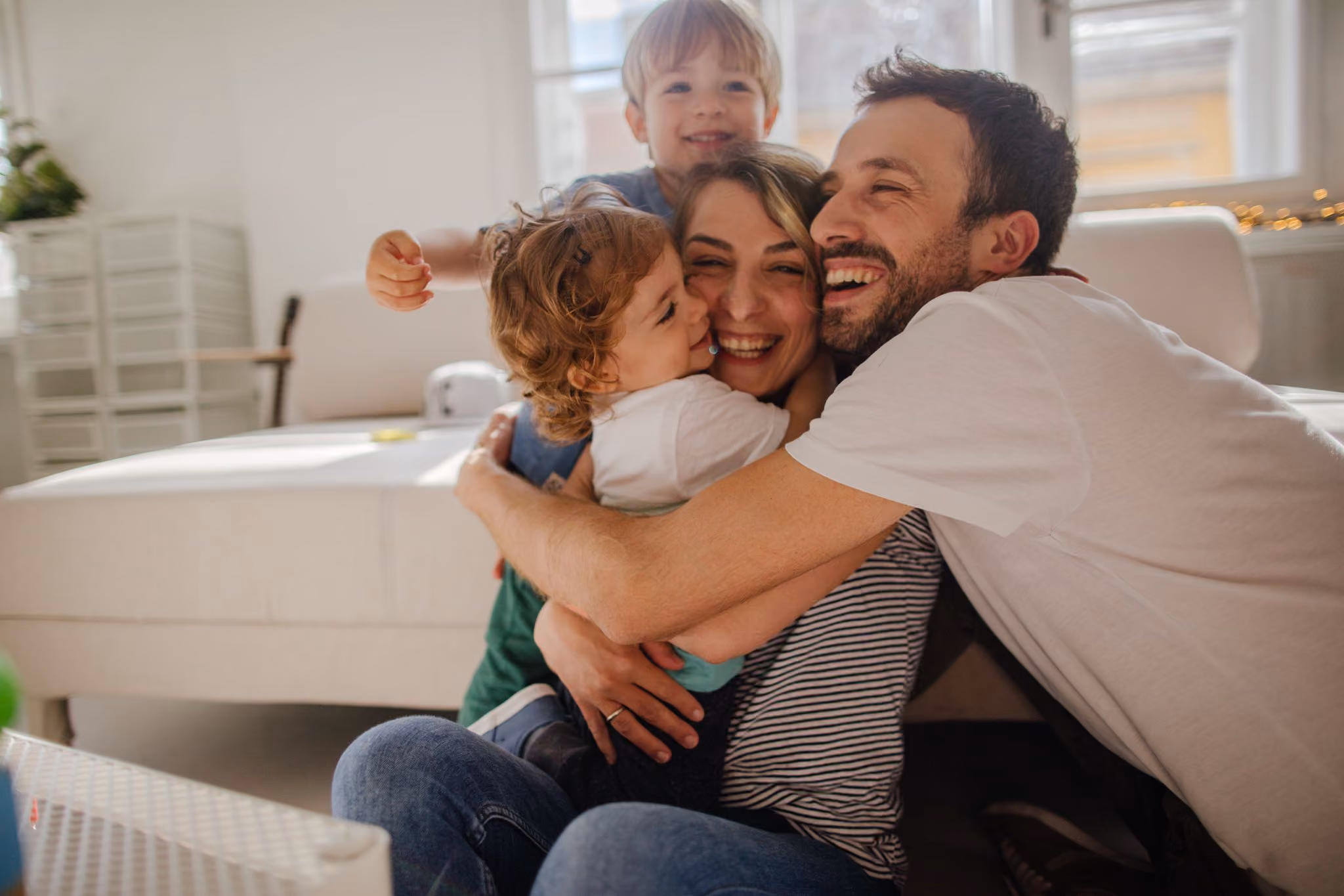 A family shares a group hug