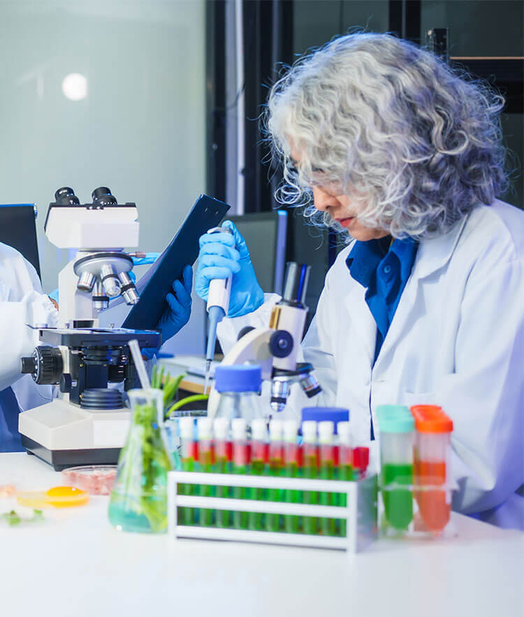 Food microbiologist with lab testing equipment