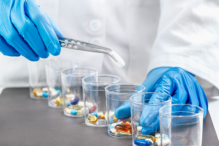 A scientist testing various supplements in a testing laboratory