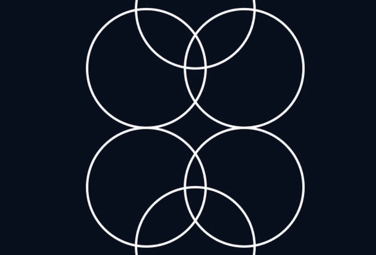 Five overlapping white circles arranged in geometric pattern on dark background