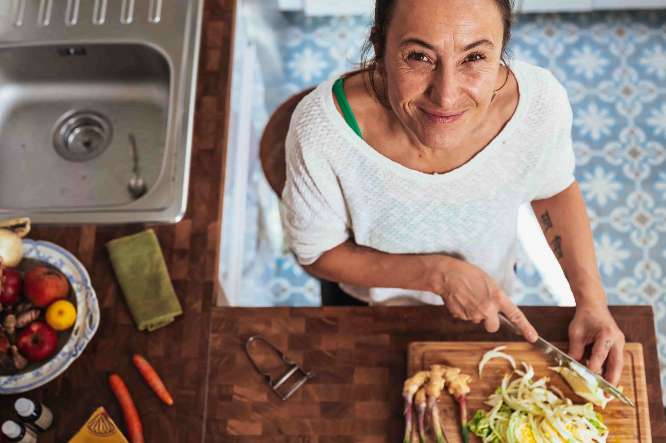 a woman preparing plant-based nutrition
