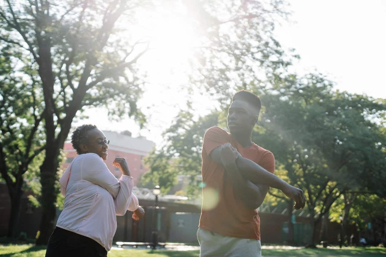 photo of mother and son stretching