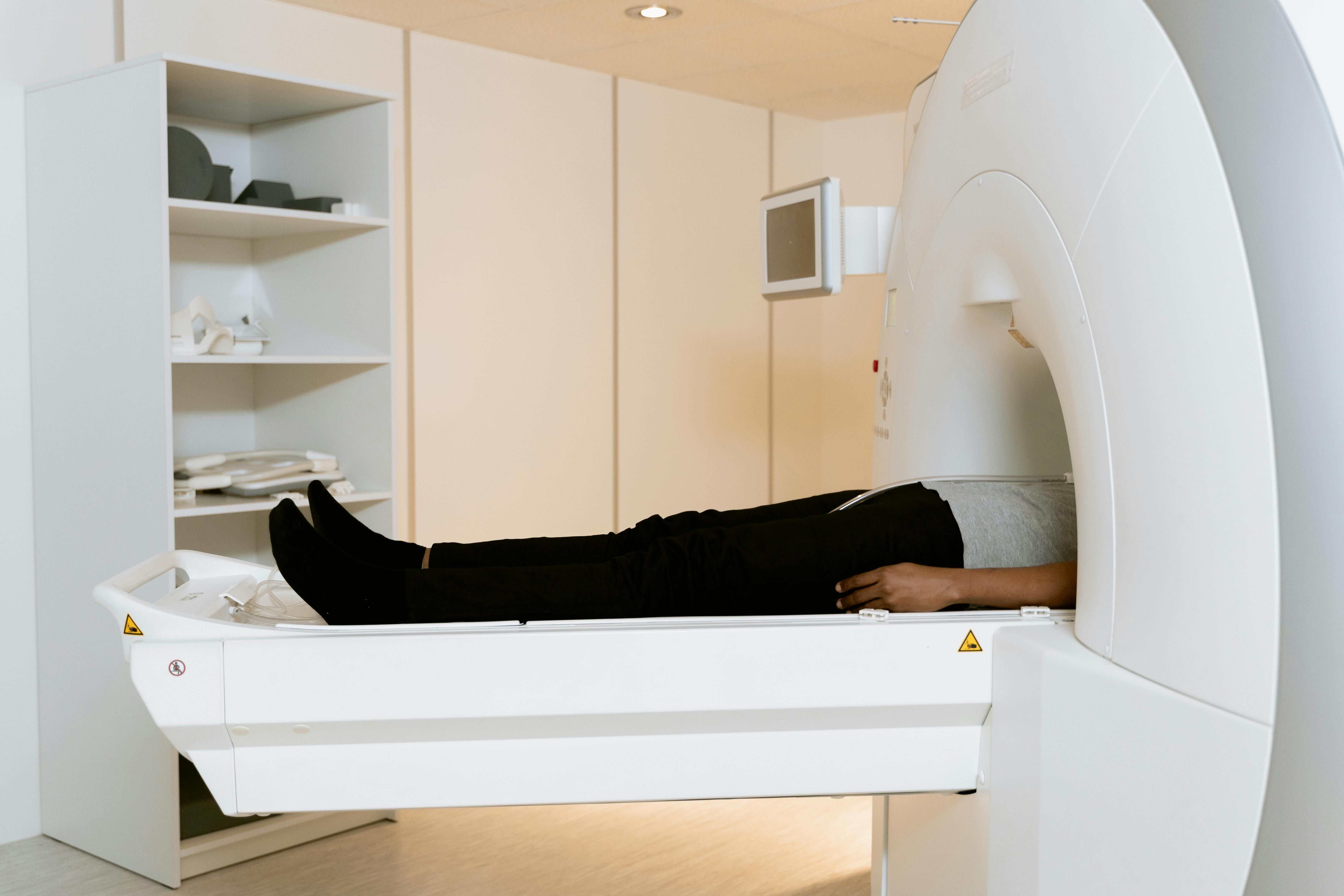 Photo of a person laying down in an MRI