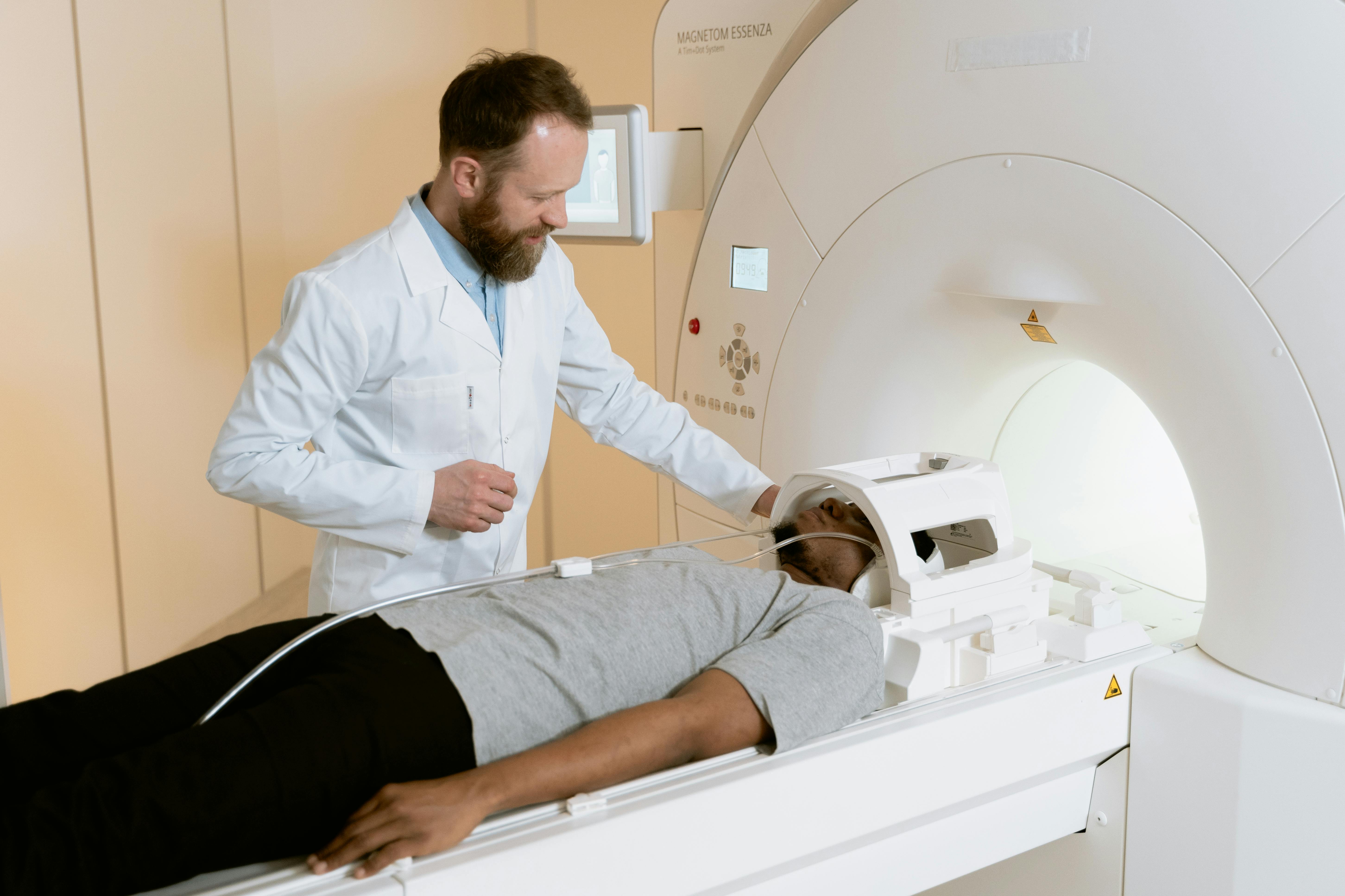 A man being prepared for a head CT