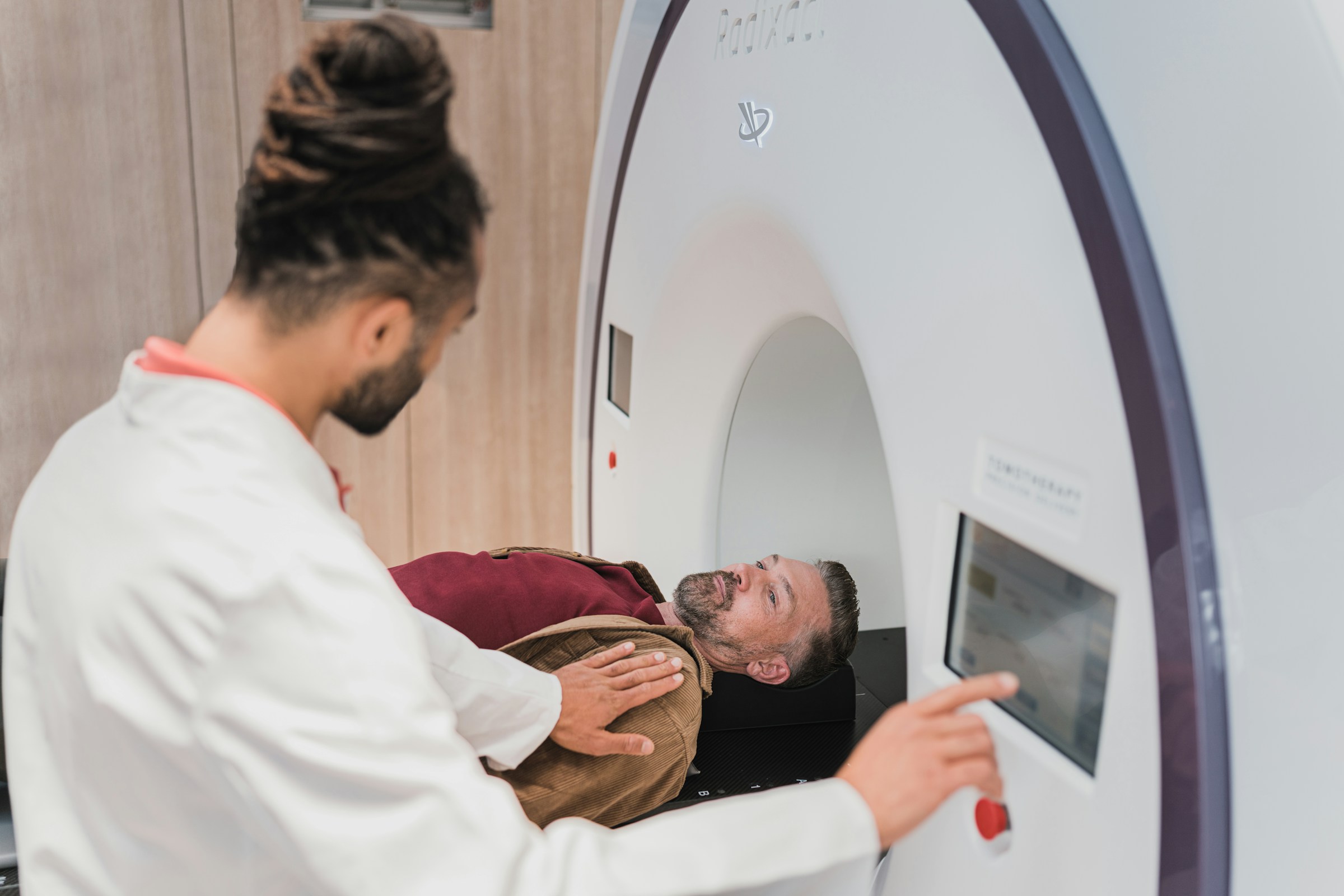 A man undergoing a CT.