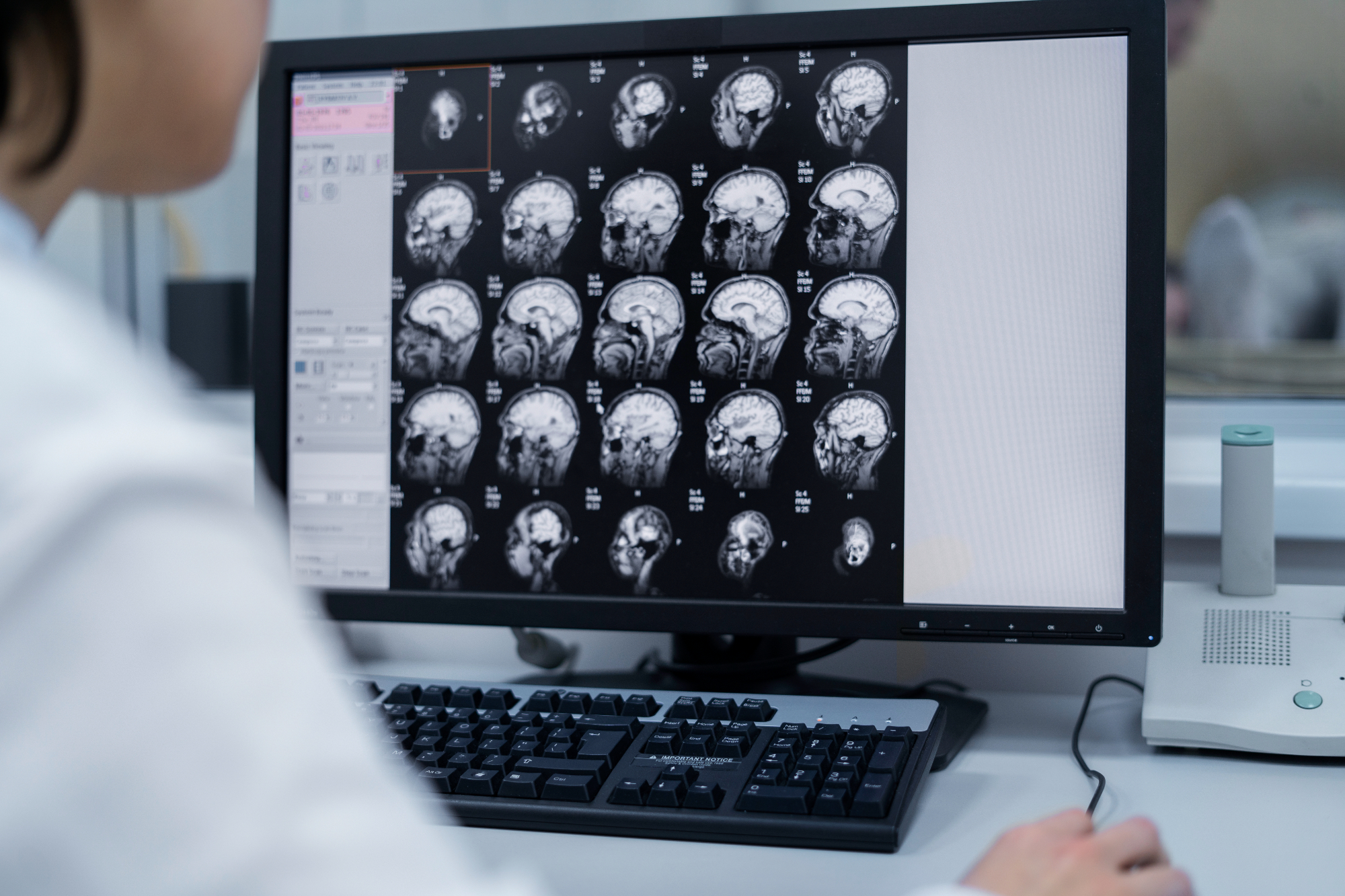 A medical professional looking over a CT.