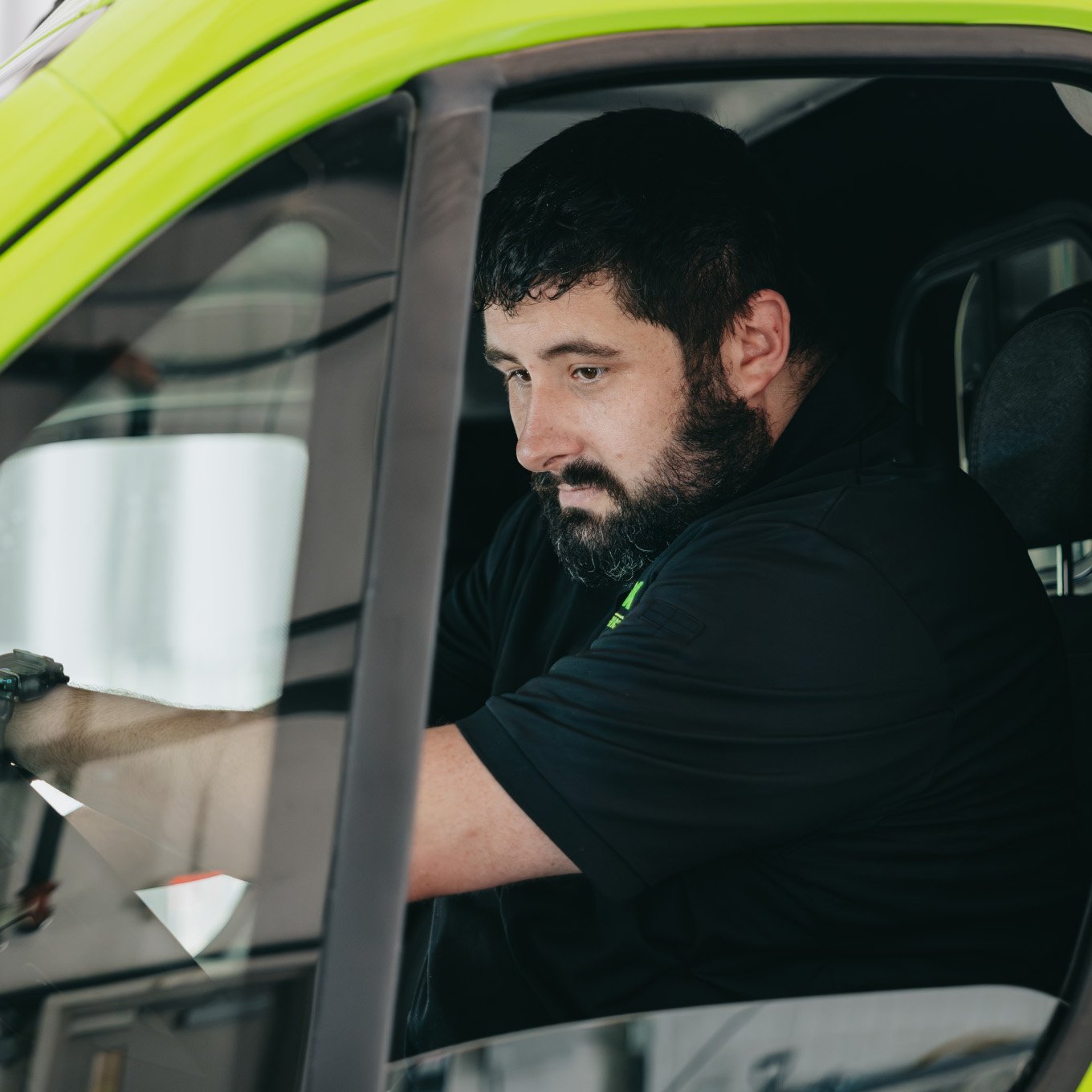Stark County paramedic in the driver's window of an ambulance